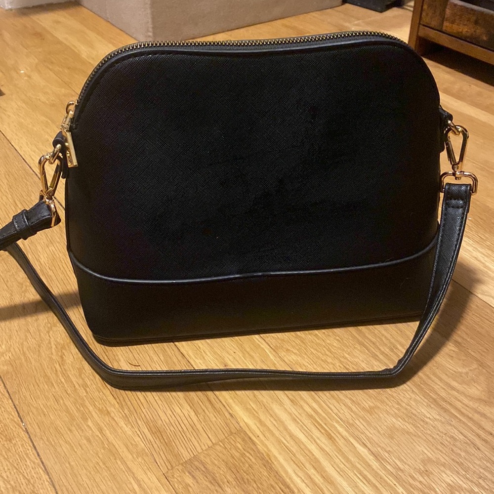 Black cross body purse with cheetah print interior